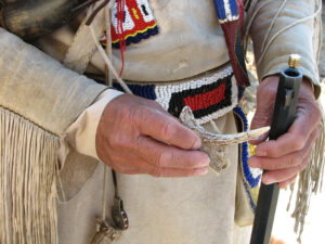Mountain Man Re Enactor Preparing To Hunt